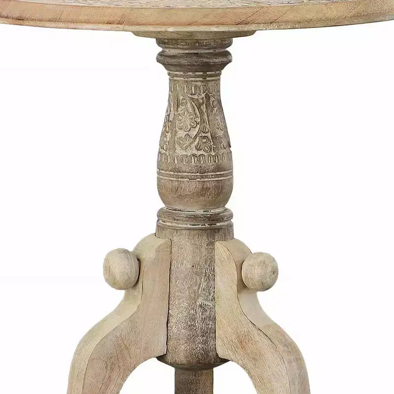 Table d'appoint en bois de manguier finement sculpté avec plateau rond et piétement piédestal