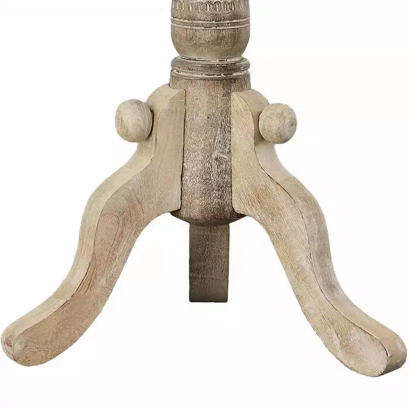 Table d'appoint en bois de manguier finement sculpté avec plateau rond et piétement piédestal